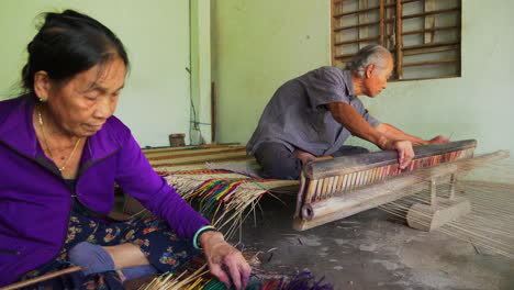 Senior-Asian-couple-making-homemade-mattress