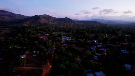 Aerial-establishing-shot-of-La-Mesa-de-San-Martin-at-night-in-Panama-City