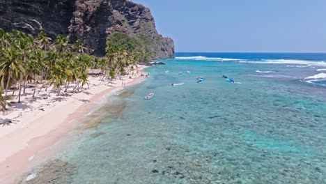 Crystal-Clear-Beach-With-Wooden-Boats-At-Playa-Fronton,-Samana-Peninsula,-Dominican-Republic