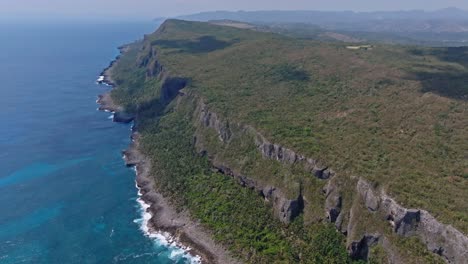 Cinematic-drone-shot-of-beautiful-coastline-covered-with-plants---Samana,-Dominican-Republic