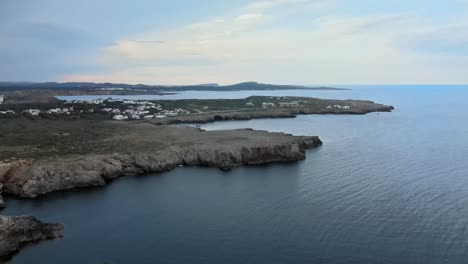 Na-Macaret-in-Menorca,-Spain-seen-from-drone-aerial-view-above-rocky-cliffs
