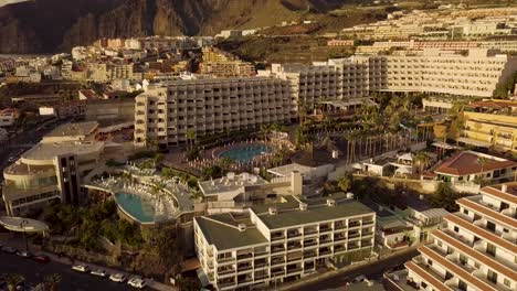 Aerial-footage-of-luxury-real-estate-in-tenerife-canary-island-spain-drone-fly-above-coastline-during-sunset