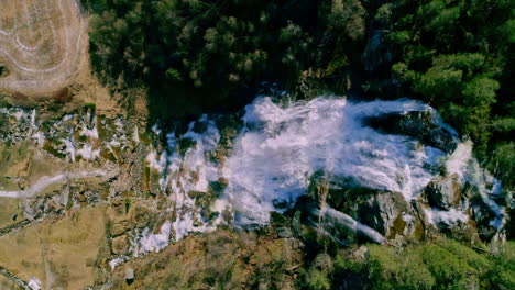 Aerial-topdown-shot-of-large-waterfall,-summer,-Norway