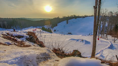 Timelapse-of-ski-resort-hill-at-sunrise,-Zagarkalns,-Latvia