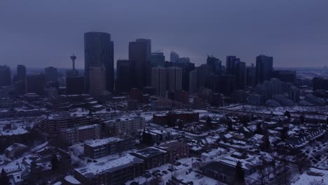 Soar-over-a-winter-city-shrouded-in-mist-with-this-stunning-drone-footage-of-a-foggy,-moody-downtown