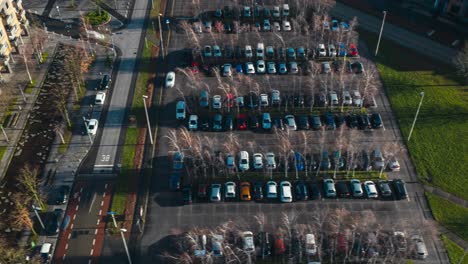 Aerial-hyperlapse-showing-buildings,-cars-and-city-landscape