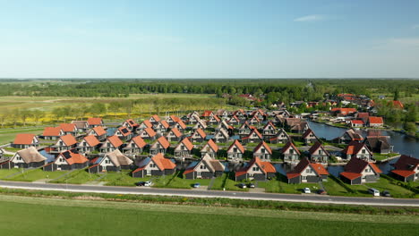 Aerial-View-Of-Detached-Villas-On-The-Waterfront-At-Holiday-Park-Waterstaete-In-Overijssel,-The-Netherlands