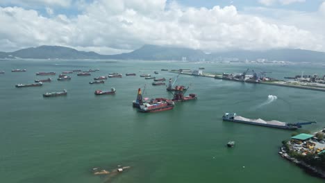 An-aerial-view-of-Dredger-ship-in-Tuen-Mun-pier,-New-Territories,-Hong-Kong