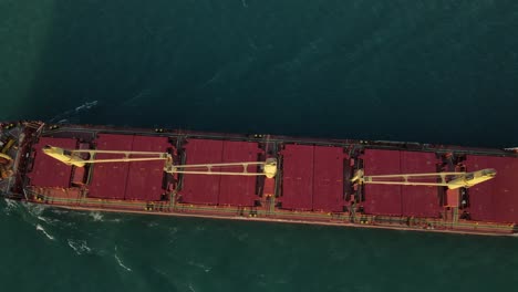 Birds-eye-view-of-a-freighter-driving-on-Michigan-River-in-USA,-Aerial-view-Top-Down