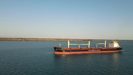 Aerial-forwarding-shot-of-Freighter-on-Detroit-River-on-a-sunny-calm-day,-USA,-America