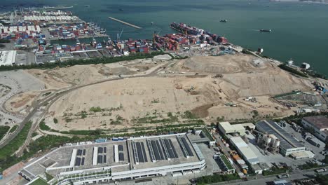 Panoramic-aerial-view-of-huge-landfill-in-Tuen-Mun,-Hong-Kong