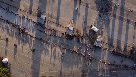 Aerial-top-down-showing-large-line-waiting-for-entering-event-at-entrance-in-Buenos-Aires