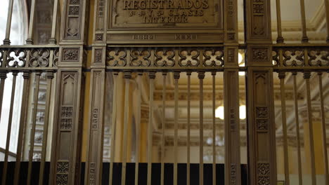 Looking-Up-At-Plaque-Sign-On-Railings-Inside-The-Post-Office-Museum-In-Mexico-City