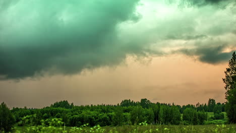 Static-shot-of-mystic-green-clouds-as-a-result-of-reflection-of-lush-green-field-below-in-timelapse-during-evening-time