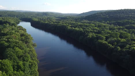 aerial-view-overlooking-river-and-trees