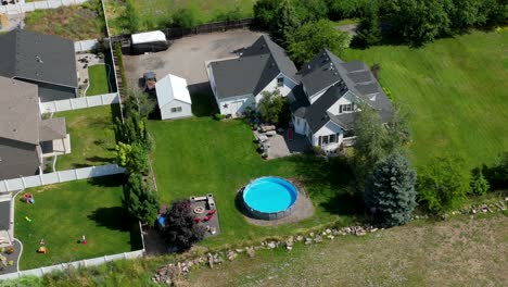 Drone-shot-above-a-nice-farmhouse-with-a-swimming-pool
