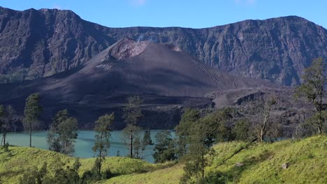 Active-Mount-Rinjani-Volcano-in-Indonesia-with-eroded-walls-panoramic,-Aerial-dolly-left-shot