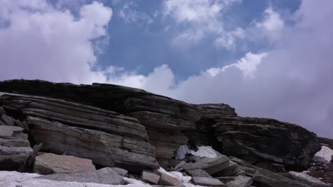 Low-angle-shot-of-nig-rocks-and-clouds-in-the-sky-of-Manali-India