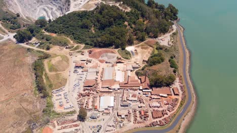 Brickyards,-strip-mining-and-related-industry-In-the-San-Francisco-area---aerial-tilt-up-reveal-of-the-bay