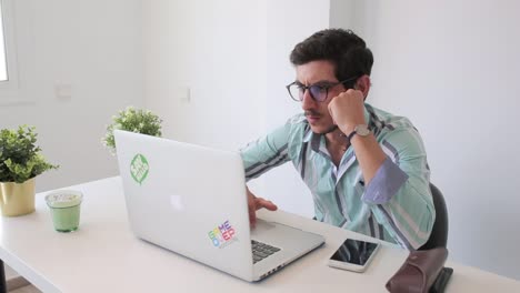 Thoughtful-man-working-on-his-notebook