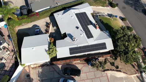 Solar-panels-on-home-rooftops-provide-efficient-alternative-energy---ascending-tilt-down-aerial-orbit