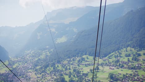 Long-shot,-ski-lift,-Switzerland,-valley,-aerial,-rising,-mountains,-high-to-top-height