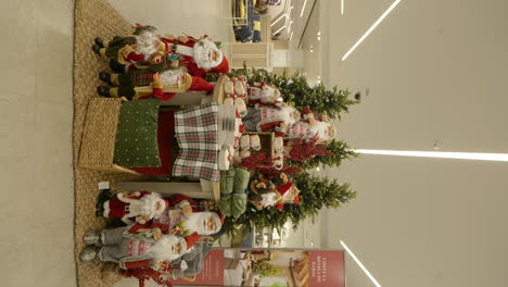 Vertical-shot-of-Christmas-decorations-displayed-at-shopping-mall,-forward