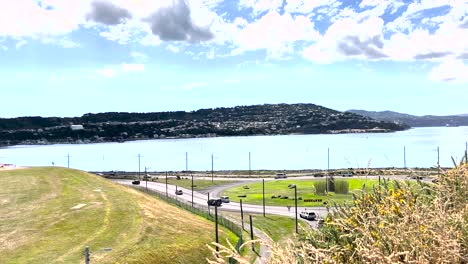 Cars-Driving-Near-The-Wellington-International-Airport-Overlooking-The-Lyall-Bay-in-New-Zealand