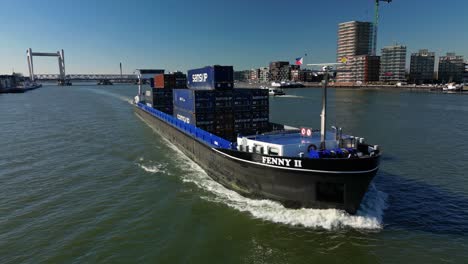 Containership-navigating-through-the-canal-of-Dordt,-The-Netherlands