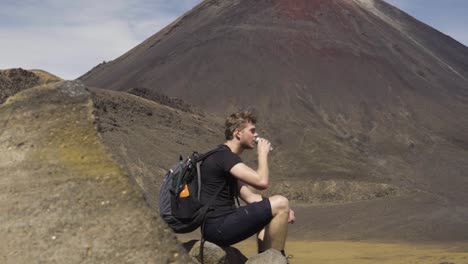 Thirsty-Man-Drank-Water-After-7-8-Hours-Of-Hike-in-Tongariro-Alpine-Crossing-in-New-Zealand
