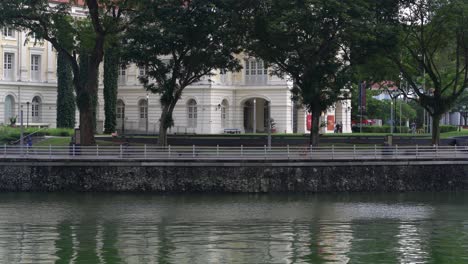 People-jogging-and-cycling-riverside-Singapore-river