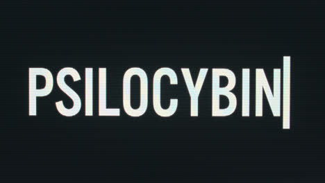 Closeup-of-Psilocybin-being-Typed-onto-Vintage-Computer-Monitor-with-Blinking-Cursor