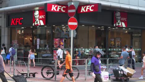 Chinese-citizens-walk-past-the-American-multinational-fast-food-restaurant-chain-company-Kentucky-Fried-Chicken-on-a-busy-street-in-Hong-Kong