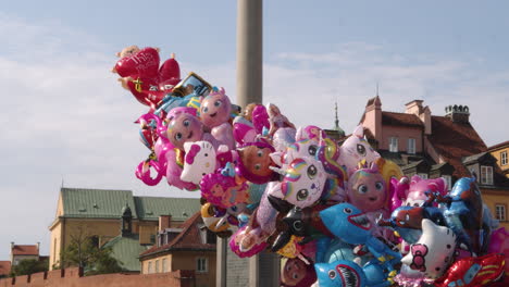 Tied-balloons-of-fairy-tale-characters-float-above-Warszava's-Old-Town