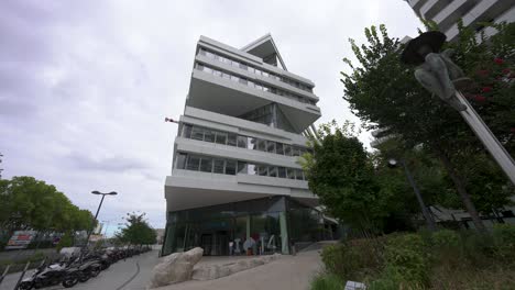 Slow-right-panel,-Capgemini-building-number-147-with-compagny-logo,-low-angle-shot-with-a-wide-angle-lens