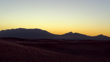 Sand-dunes-and-mountains-in-Sahara-Desert-in-North-Africa-at-sunrise