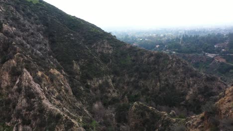 Eaton-Canyon-Falls-trail-beginning-and-sweeping-through-the-mountains-and-overlooking-Pasadena,-California