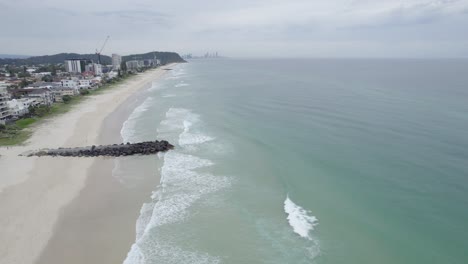 Ocean-And-Coastal-Suburb-In-Palm-Beach,-Gold-Coast,-Queensland,-Australia---aerial-drone-shot
