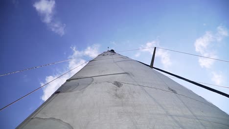 the-upwards-shot-of-sail-in-a-yacht-from-the-deck