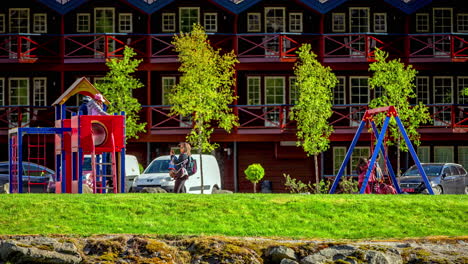 Kids-having-fun-in-playground-in-Norway,-fusion-time-lapse