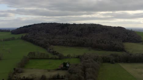 Aerial-establishing-shot-of-Knockma-hill-and-its-wooded-area,-Galway,-Ireland