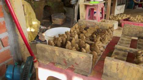 Beautifully-crafted-animal-clay-figures-drying-in-the-sun-in-Thanh-Ha,-a-popular-destination-for-souvenir-hunters-and-tourists