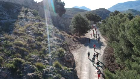 People-running-a-mountain-marathon-on-arid-roads