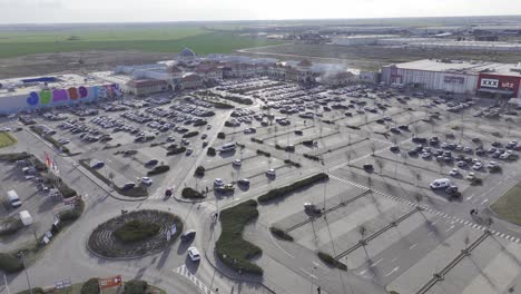 Aerial-view-of-cars-arriving-parking-area-of-shopping-center-in-Bucharest,Romania