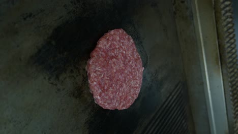 Vertical-Shot-Of-Hamburger-On-Grill