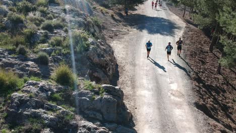 People-running-a-mountain-marathon-on-arid-roads