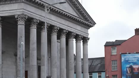 Courthouse-crossing-in-Cork-City-with-historical-building-and-Irish-flag