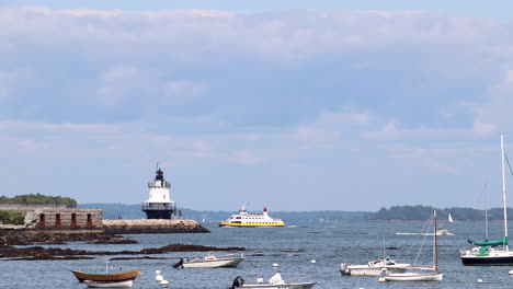 Looking-out-at-sail-boats-anchored-in-a-harbor-at-Willard-Beach-in-Portland,-Maine