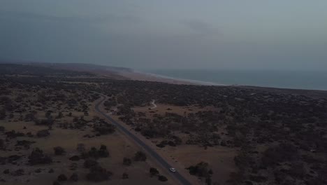 Aerial-view-of-car-driving-in-the-south-of-morocco