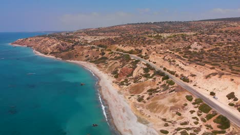 Aerial-static-shot-looking-down-over-the-Mediterranean-sea-and-beach-coast-of-Paphos-Cyprus